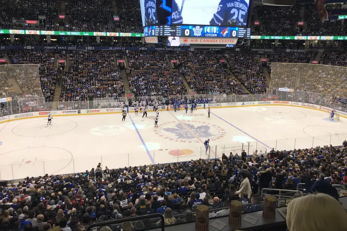 Toronto Maple Leafs game on the ice with a packed arena